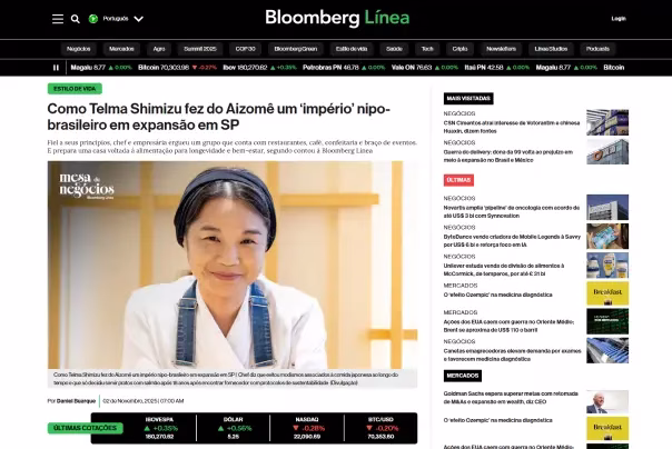Captura de tela de um artigo da Bloomberg Línea que apresenta Telma Shimizu, chef e fundadora do Aizomê, com seu retrato e a manchete sobre a expansão de seu restaurante nipo-brasileiro em São Paulo.